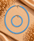 Parure en agate bleue translucide – collier et bracelet en perles uniformes avec fermoir argenté